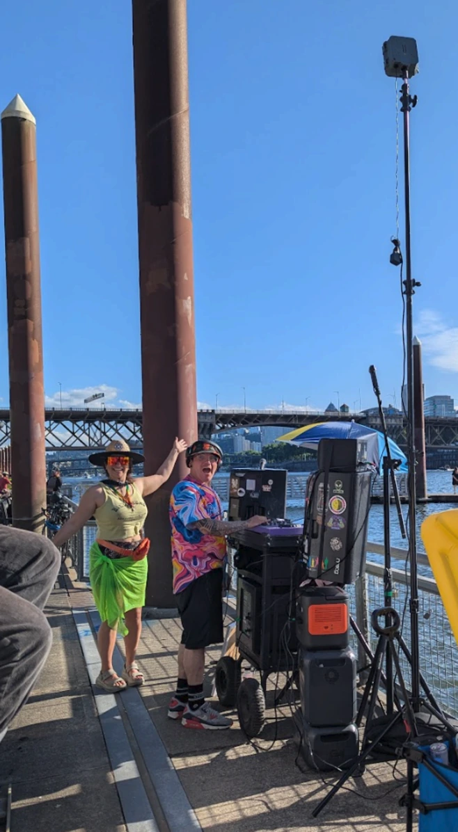 traffic monitor on tripod for a dj on the dock event near the river