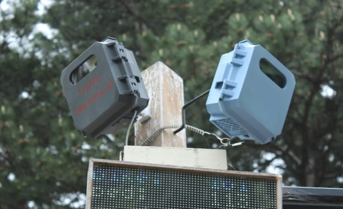 two traffic monitors and the display deployed over a road